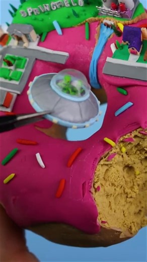 with beautiful tiny buildings, let's rig the FORTNITE ufo in the air. i hope you enjoyed today's crazy build: building SPRINGFIELD on a donut. #fortnite #simpsons #springfield #donut #ufo | ClayClaim
