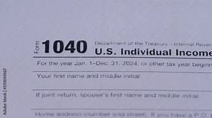 Close-up of 1040 tax forms on sheets, multiple tax forms, concept of paying taxes for individuals