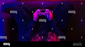 girl's hands top view with the video game controller and colorful lights Stock Photo - Alamy