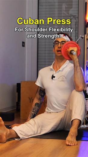 Coach Elia - Stretching & Handstand on Instagram: "The Cuban Press This is one of the best exercises for shoulder flexibility and strength — let’s see how to do it. You want to keep your elbow at shoulder height. On the way down, you’re stretching your external rotators — feel that lengthening. Then, press back up, squeeze your external rotators, and come up strong. 💪 Flexibility and strength, all in one move. The closer your arm moves in, the more it stretches your external rotators — tougher 