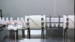 Bottle production for packing. Bottles in a line for filling. Manufacturing process of bottles for packing.