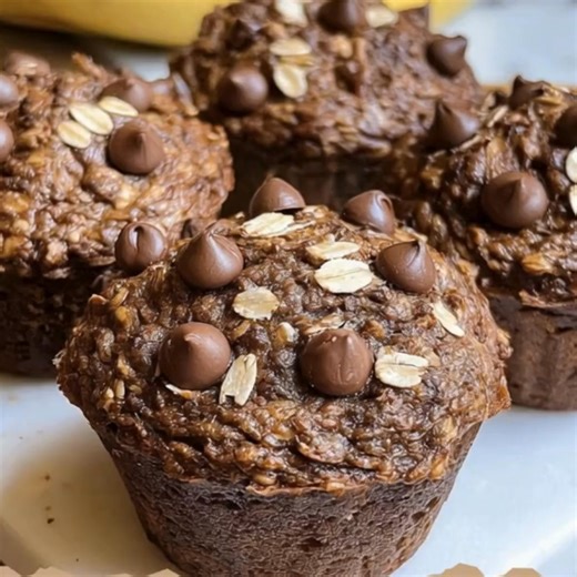 Healthy Greek Yogurt Chocolate Oat Banana Muffins 🍫🍌 Yield: 9–12 | Oven: 350°F / 180°C | Bake: 18–22 min Ingredients 2 ripe bananas, mashed ½ cup plain Greek yogurt (125 g) ¼ cup honey or maple syrup (60 ml) 1 large egg 1 tsp vanilla ⅓ cup unsweetened cocoa (30–35 g) 1 cup oat flour (90 g) (or blend rolled oats fine) ½ tsp baking soda ¼ tsp salt ⅓ cup chocolate chips (60 g) extra (optional) (Optional) ½ tsp baking powder for extra lift Instructions Preheat to 350°F / 180°C. Line/grease muffin 