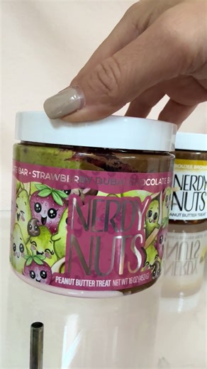 Strawberry Dubai Chocolate Bar peanut butter… why does this look like a whole dessert in a jar?! 🍓🍫🤤 I’m obsessed already. #holidayhaul #holidayhustle #peanutbutter #nerdynuts #tiktokshopcreatorpicks