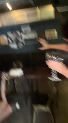 Drunk Woman Falls on Her Back While Hanging From Ceiling Bar