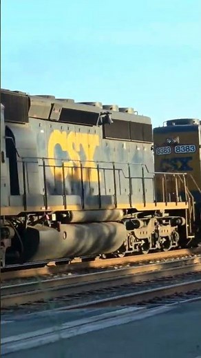 Pair of SD40-2 engines lay on the horn as they roar by in full power.