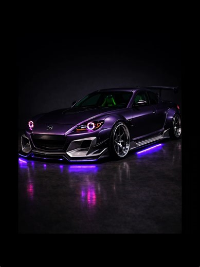 Mazda RX-8 – Purple Irish Edition Matte purple meets uncompromising widebody aggression. Brushed metal front bumper, side skirts, and rear diffuser create a brutal contrast against the dark bodywork. A continuous purple underglow runs along the entire lower line, amplifying the car’s low stance and visual depth. Inside, Irish green makes a bold statement. Alcantara, racing seats, and carbon details merge into a focused performance atmosphere. From the sharp front view to the glowing exhaust, thi
