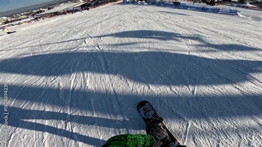 Snowboard run at a ski resort in winter, capturing speed and movement