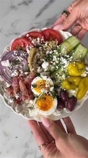 Audrey Lillian on Instagram: "savory girl snack plate details below💌 I’ve seen this snack plate all over social media and it’s become a favorite for me it’s SO delicious and customizable! As a savory girl myself I really appreciate this trend🤭 give it a try! Ingredients: -Tzatziki -cucumber -tomato -red onion -prosciutto (can use other meat too) -soft boiled egg -artichoke hearts -pepperoncini -feta -olive oil -salt and pepper -fresh dill #snackplate #savory #easyrecipes #healthyrecipes #whati