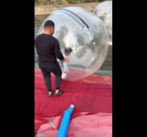 Boy enjoys water ball ride in Shandong, China