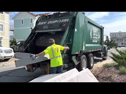 Bay Disposal Rear Loader Garbage Truck Packing Massive Piles of Bulky Waste and Mattresses