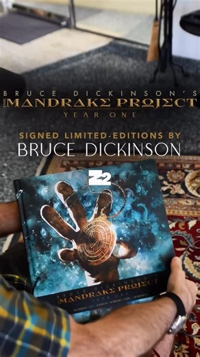Bruce Dickinson on Instagram: "Bruce got his hands on the deluxe edition of The Mandrake Project: Year One! This edition features everything Mandrake so far… All comics from the prologue right up to episode 4, exclusive trading cards, and a Mandrake coin reproduction 🔥 Head to Z2comics.com or link in story to take a look! #TheMandrakeProject #BruceDickinson"