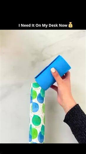 Time Unfolded on Instagram: "This video highlights a practical gift-wrapping technique that uses simple tools to achieve a cleaner, more professional finish while reducing material waste. The blue plastic tools shown are edge-smoothers or folding guides, commonly used in crafting and packaging to create sharp, even creases without tearing decorative paper. Wrapping paper is often coated or laminated for shine, which makes it prone to wrinkling or cracking when folded by hand; using a flat guide 