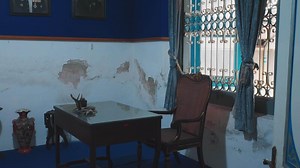 Vintage Office Space with Wooden Desk and Ornate Chair