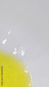 Making homemade waffles in an electric waffle maker. breakfast chef mixing flour, eggs with whisk, cooking dough for baking waffles, pancakes. Morning breakfast food preparation, recipe instruction