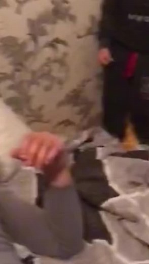 Playful Child Dancing in Cozy Bedroom Setting