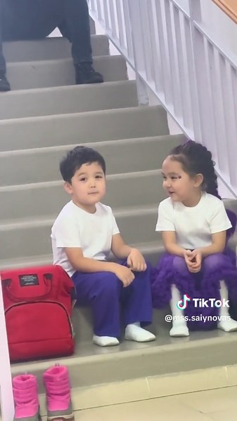 Adorable Kids Talking on Staircase