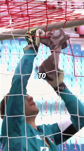 This goalkeeper is trying to repair the net