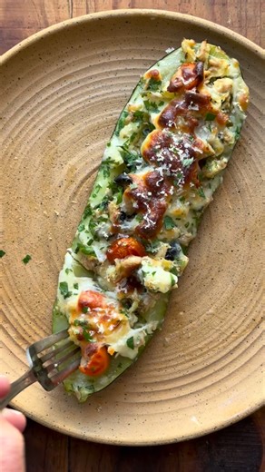 These stuffed zucchini are filled with all the good things and they are simple enough to make for a quick weeknight meal. I slice a few zucchini in half and hallow them out keeping the insides for the filling. Chop the filling up and add to a bowl. To the bowl, I add about a cup of chopped olives, a cup of sliced tomatoes, 1 cup of cubed mozzarella cheese (or any cheese you want), 2 cans of good tuna that has been drained, 2 cloves grated garlic, some chopped parsley and chives, salt, pepper and