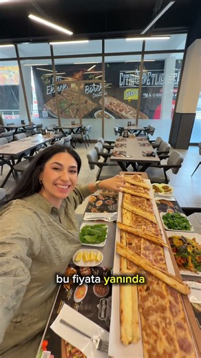 Meat bread is 120₺, served with raw meatballs, pickles and green varieties.