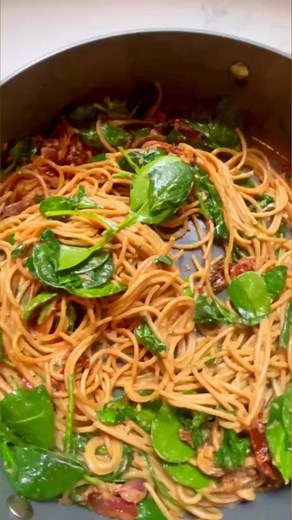 Spaghetti & Spinach with Sun-Dried Tomato Cream Sauce: This easy pasta recipe is perfect for weeknight dinners. The spinach and pasta cook quickly, while a sun-dried tomato cream sauce adds flavor fast. Get the recipe: https://bit.ly/44ghixF | EatingWell