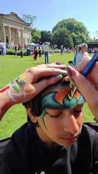 Fast Batman face painting on the job in York. This Batman design is o...