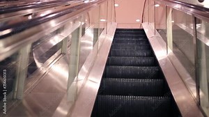 Movement of lifting on modern shiny escalator in building