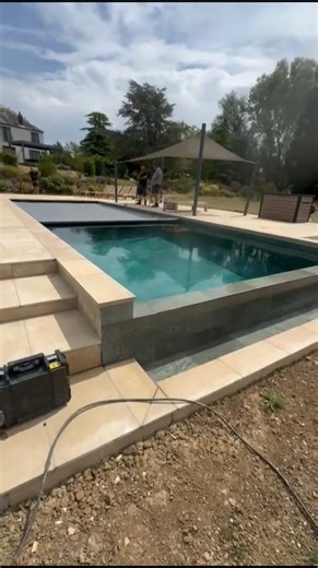 "Full new build, infinity edge swimming pool and all — 100% built by us.This one turned out perfect.