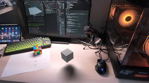 AI code creates 3D animation: OpenAI Codex combined with Blender via MCP creates magic ⚡. A Python script simulates hundreds of gray blocks disintegrating and arranging themselves into a spiral on a work surface. Place it next to a real Rubik's Cube to see the realism 🔮.