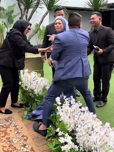 Bride falls after bouquet toss at Bandung wedding in West Java, Indonesia
