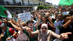 Braving police and heat, Algerians take to streets pressing for real change