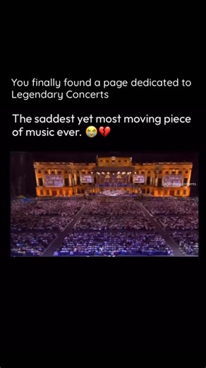 Legendary Concerts on Instagram: "The video features a professional orchestral concert set on a large stage bathed in moody, deep purple and blue lighting. The central focus is the world-renowned violinist and conductor, André Rieu, standing center stage. He is wearing a formal tuxedo with a white cravat, playing a violin with intense, sorrowful facial expressions. The camera cuts between close-ups of him playing and panning shots of the audience, who are seated and appear deeply emotional-some