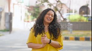 Indian Girl with Curly Hair Laughing Out Loud