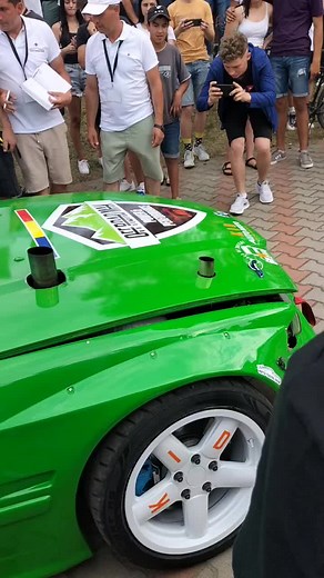 Auto Tuning Show: Car Enthusiasts Gather Around Sports Car