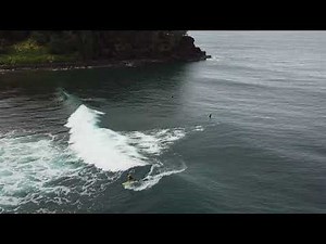 Surfers in Kauai by drone at Hanalei and Anini Beach