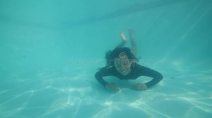 Attractive Asian Girl Diving in Pool Underwater Looking at Camera and Smiling. Stock Video - Video of dive, floating: 168262971