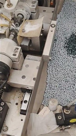 the process of making small balls using sophisticated machines in the factory