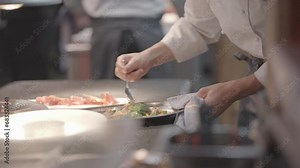 Kitchen staff working in the restaurant making delicious food recipes
