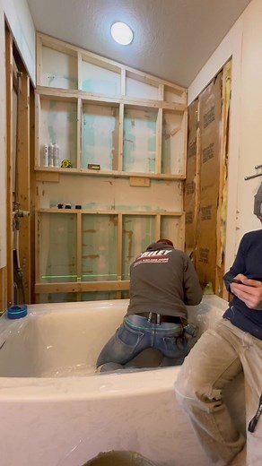 How to install an acrylic bathtub and waterproof surround system. #tile #tiledesign #work #diy #construction #bathroom #shower #tileshower #niche #tools #carpentry #homeimprovement #homerenovation #tutorials #tutorial #hardwork #tips #tipsandtricks #remodel #demo #plumbinghacks #rileyhomeremodel #fbreels | Seth Riley