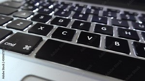 4K video close up shot of used laptop computer or notebook keyboard keys. Close up on letters