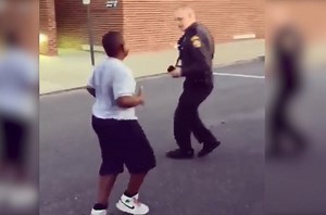 A cop and a kid battle it out ... through dance