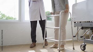 Portrait of caucasian doctor check up body of sick old senior elderly patient using walker, walking in hospital in medical and healthcare treatment at nursing home or clinic. People lifestyle