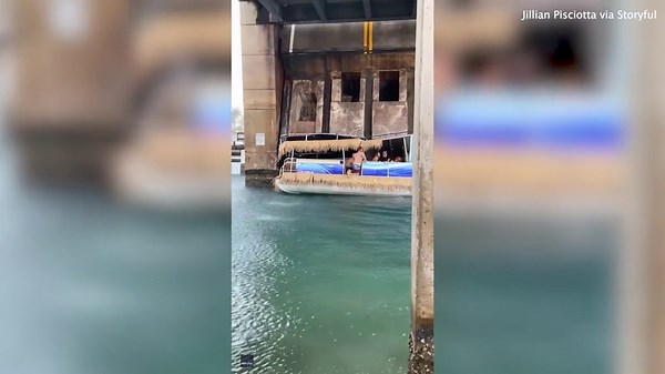 Florida boaters jump ship after a drawbridge partially crushes their pontoon.