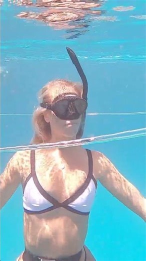 mermaid girl swims through bubble ring