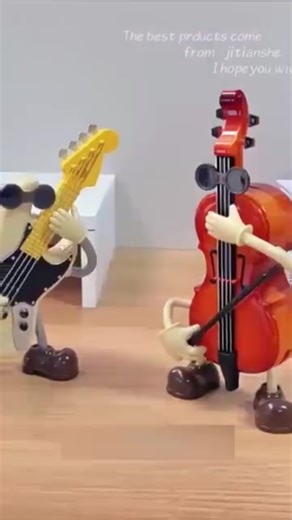4K views | Musical Instrument Figurines: Cello & guitar characters with cool sunglasses. A fun, creative decor for music lovers and home spaces! ✨https://t.site/3JvUuoF | Designatem-ate | Facebook