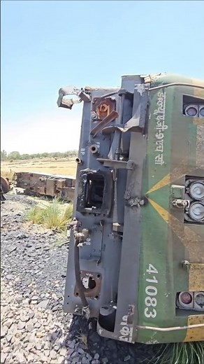 How do train wheels stay on the tracks ( conical shape of a train wheel help it navigate curves )