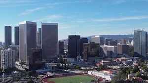 Century City business district skyline in Los Angeles, California on a sunny day - pullback aerial view