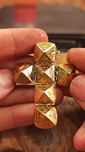 soroush jwl on Instagram: "Witness the transformation of a multi 50¢ brass coin into a fully handmade Masonic Orb—one of the most fascinating historical objects in Masonic tradition. This unique pendant opens into multiple engraved panels, each symbolizing different teachings, rituals, and mysteries passed down through generations. In this video, I craft the entire piece completely by hand: – Handmade from a multi brass coin – No machines used – All forging, filing, shaping, and polishing done b