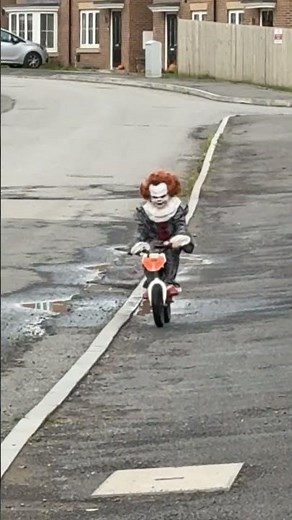 Child dressed as Pennywise rides bike for Halloween in Middlesbrough, UK