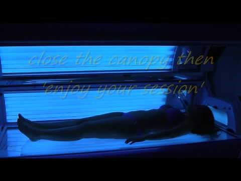 A GIRL IN A SOLARIUM - tanning bed