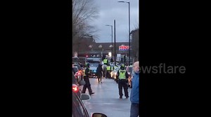 Everton and Millwall fans clash outside the Den